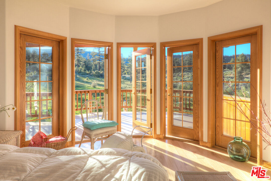 33224 Seymour Canyon Road Frazier Park, CA 93225 - Photo 2 of 32 a bedroom with a bed and glass windows