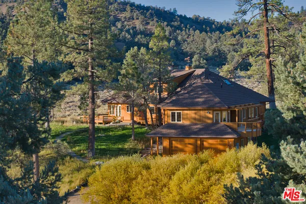 an aerial view of residential houses with yard and swimming pool