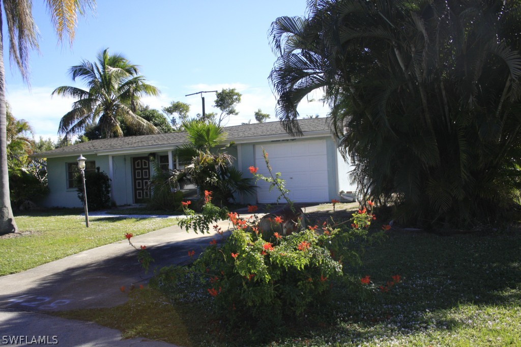 1428 Byron Road Fort Myers, FL 33919 - Photo 1 of 10 front view of house with a yard