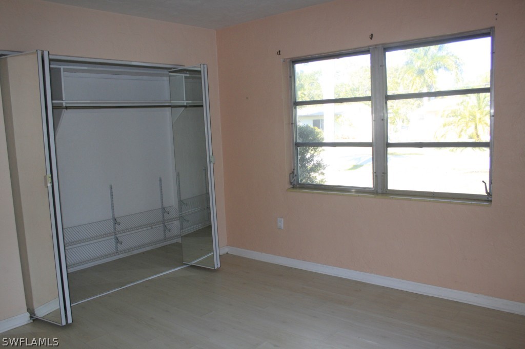 1428 Byron Road Fort Myers, FL 33919 - Photo 6 of 10 an empty room with a window