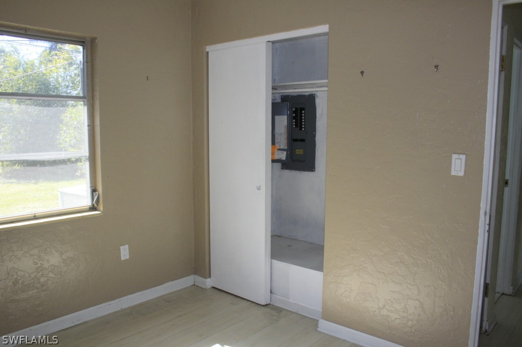 1428 Byron Road Fort Myers, FL 33919 - Photo 7 of 10 an empty room with windows and entrance