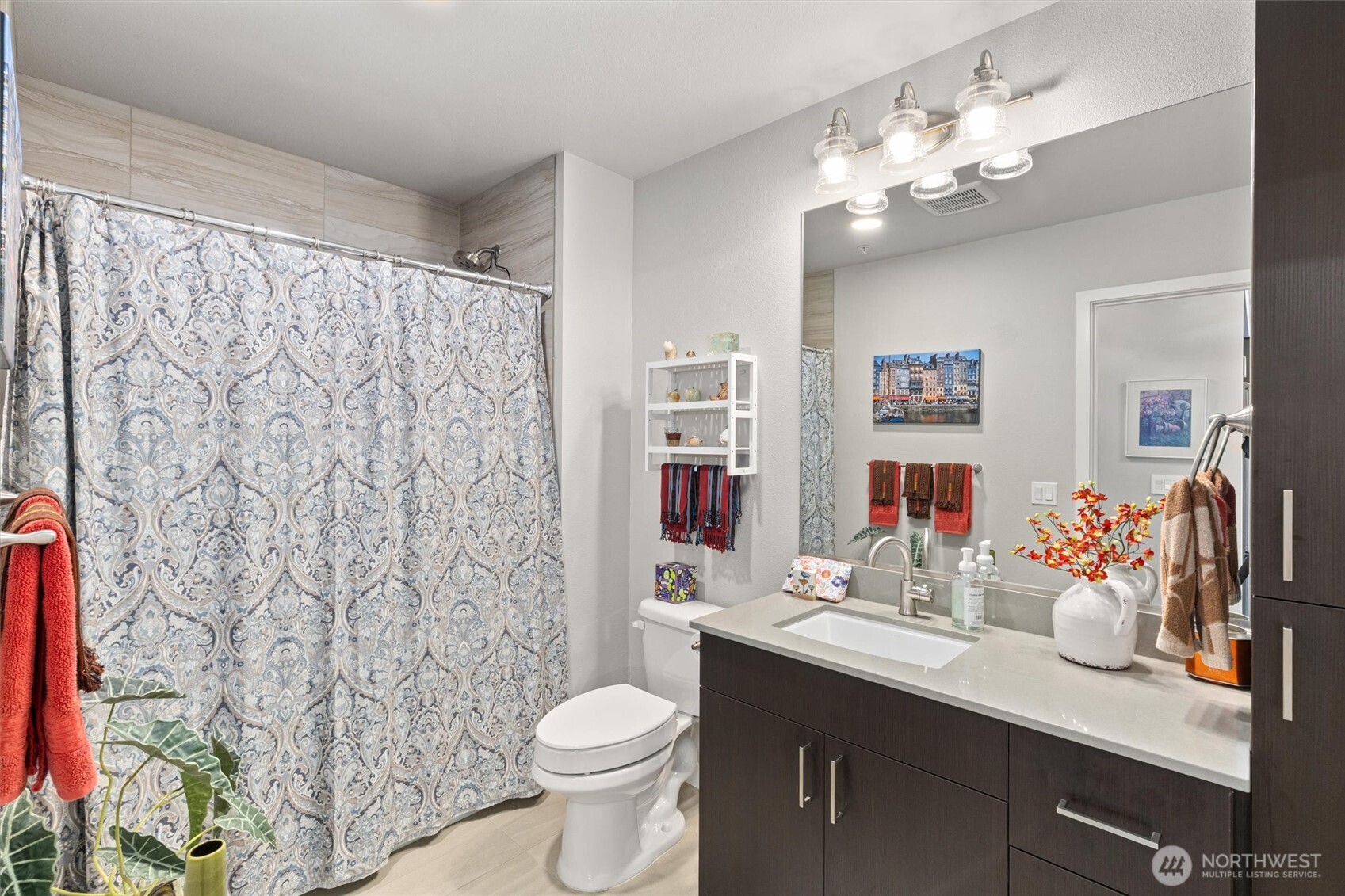 50 Pine Street, Unit 103 Edmonds, WA 98020 - Photo 22 of 40 a bathroom with a toilet sink and mirror