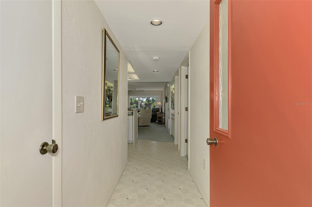 6800 Placida Road, Unit 146 Englewood, FL 34224 - Photo 13 of 64 a view of a hallway with closet and a bathroom