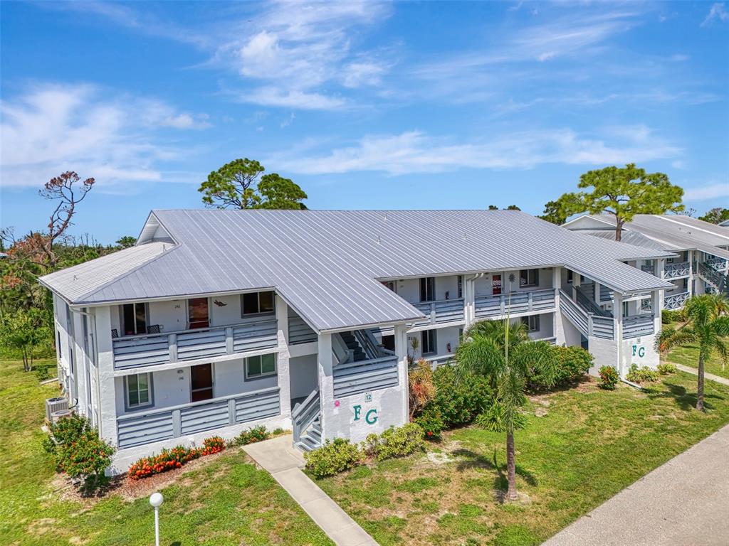 6800 Placida Road, Unit 146 Englewood, FL 34224 - Photo 8 of 64 a house view with a garden space