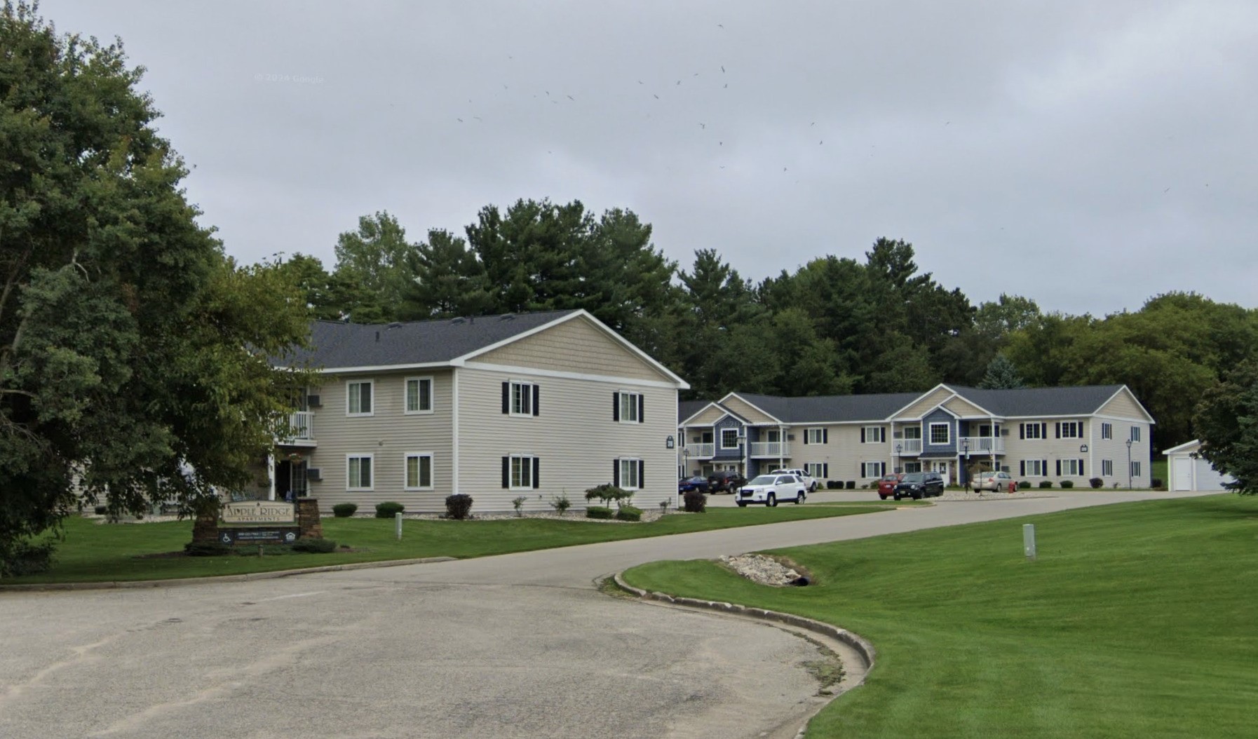 a view of house and outdoor space with trees around