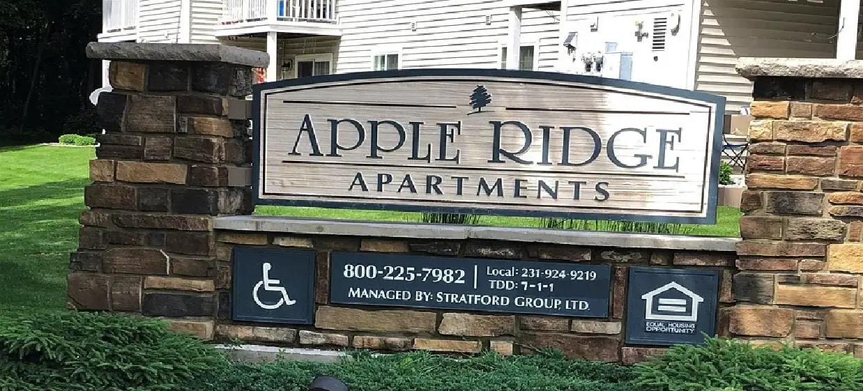 318 Dewitt Avenue Fremont, MI 49412 - Photo 6 of 7 a street sign on a pole on a street