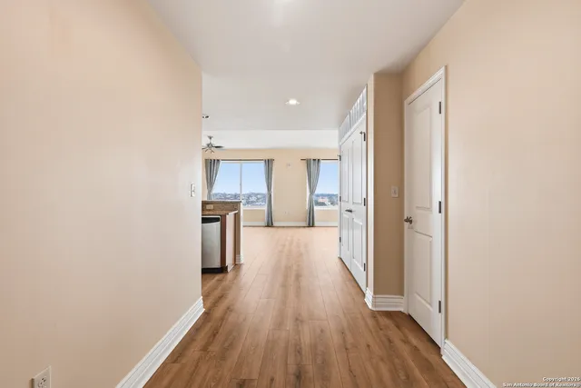 a view of a kitchen from the hallway