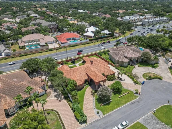 an aerial view of residential houses with outdoor space