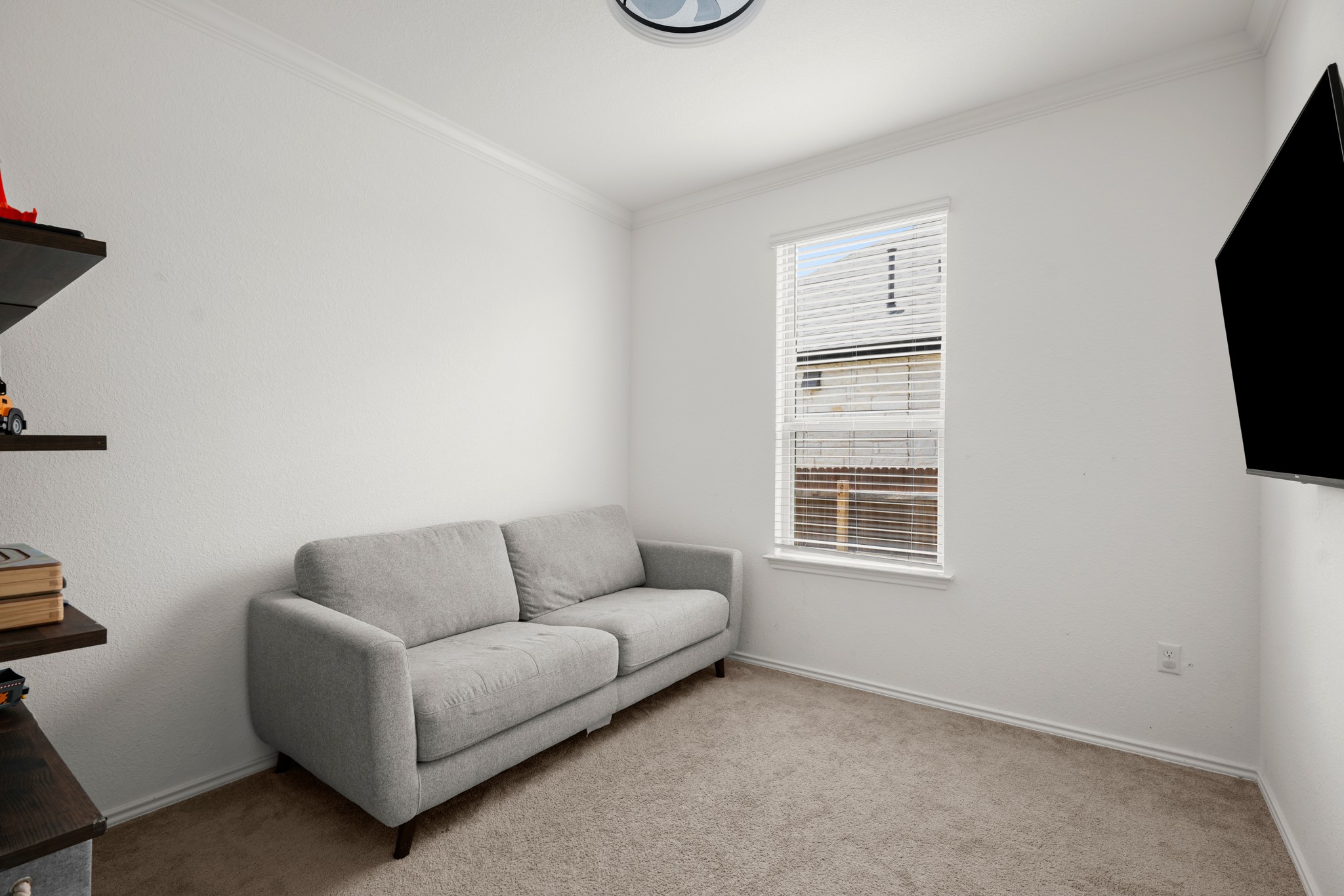 500 Pickrell Loop Georgetown, TX 78628 - Photo 23 of 29 a living room with furniture and a flat screen tv