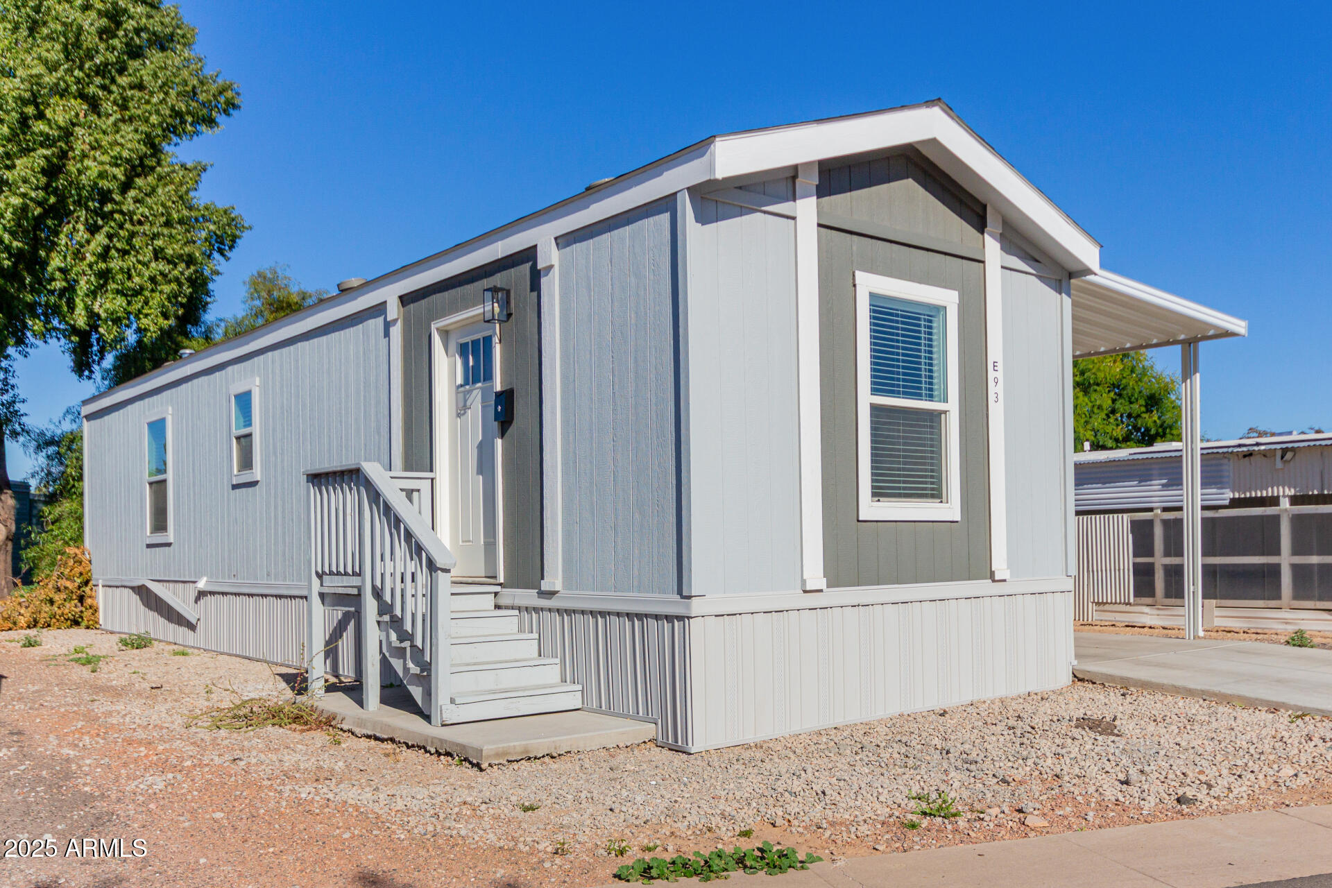 5201 West Camelback Road, Unit E093 Phoenix, AZ 85031 - Photo 2 of 13 a front view of a house with a yard