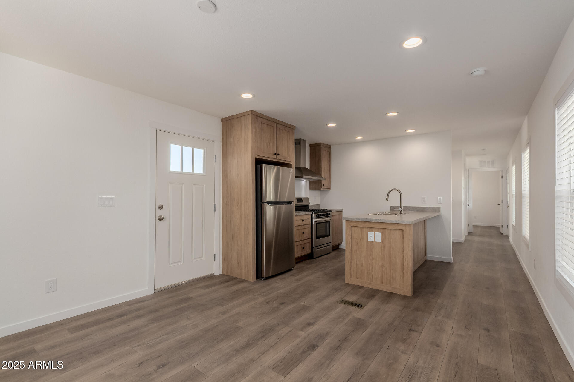 5201 West Camelback Road, Unit E093 Phoenix, AZ 85031 - Photo 3 of 13 a view of a kitchen with a sink and refrigerator