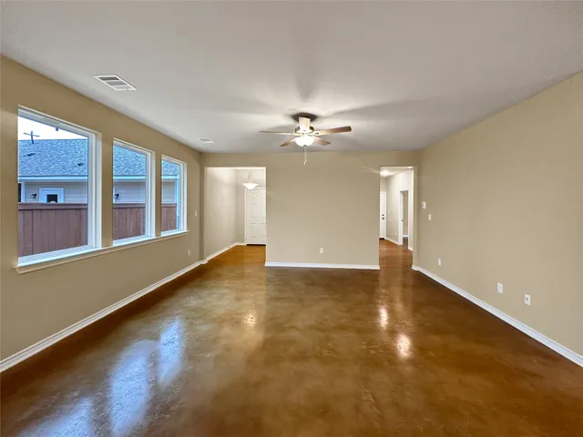 a view of an empty room with a window