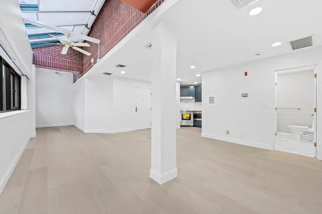 a view of a livingroom with wooden floor