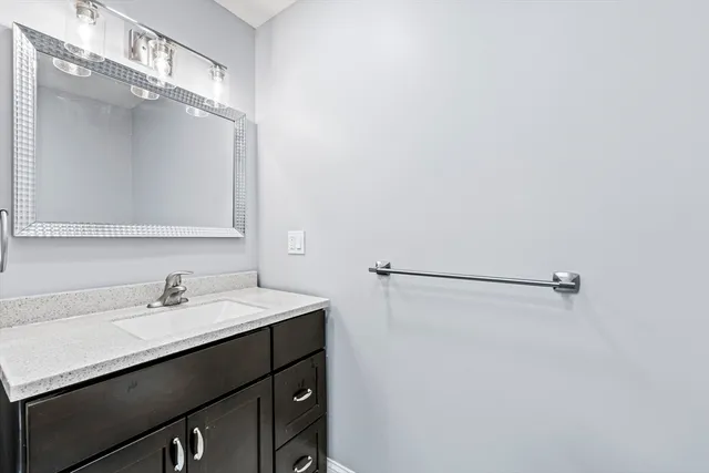 a white toilet sitting next to a bathroom sink