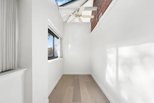 a bathroom with a toilet sink and a mirror