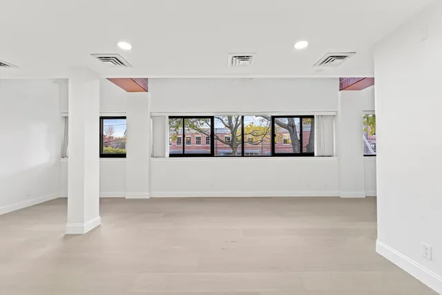 a view of an empty room with windows
