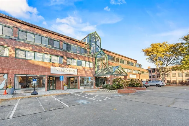 a view of a cars parked on the side of a street