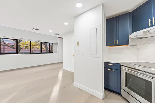 a kitchen with a stove and a refrigerator