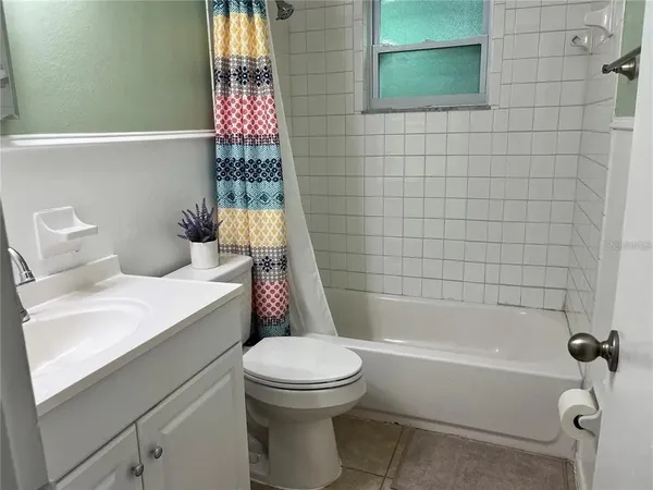a bathroom with a bathtub and shower