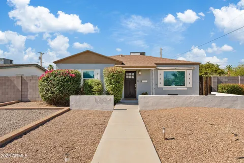a view of house with yard and entertaining space