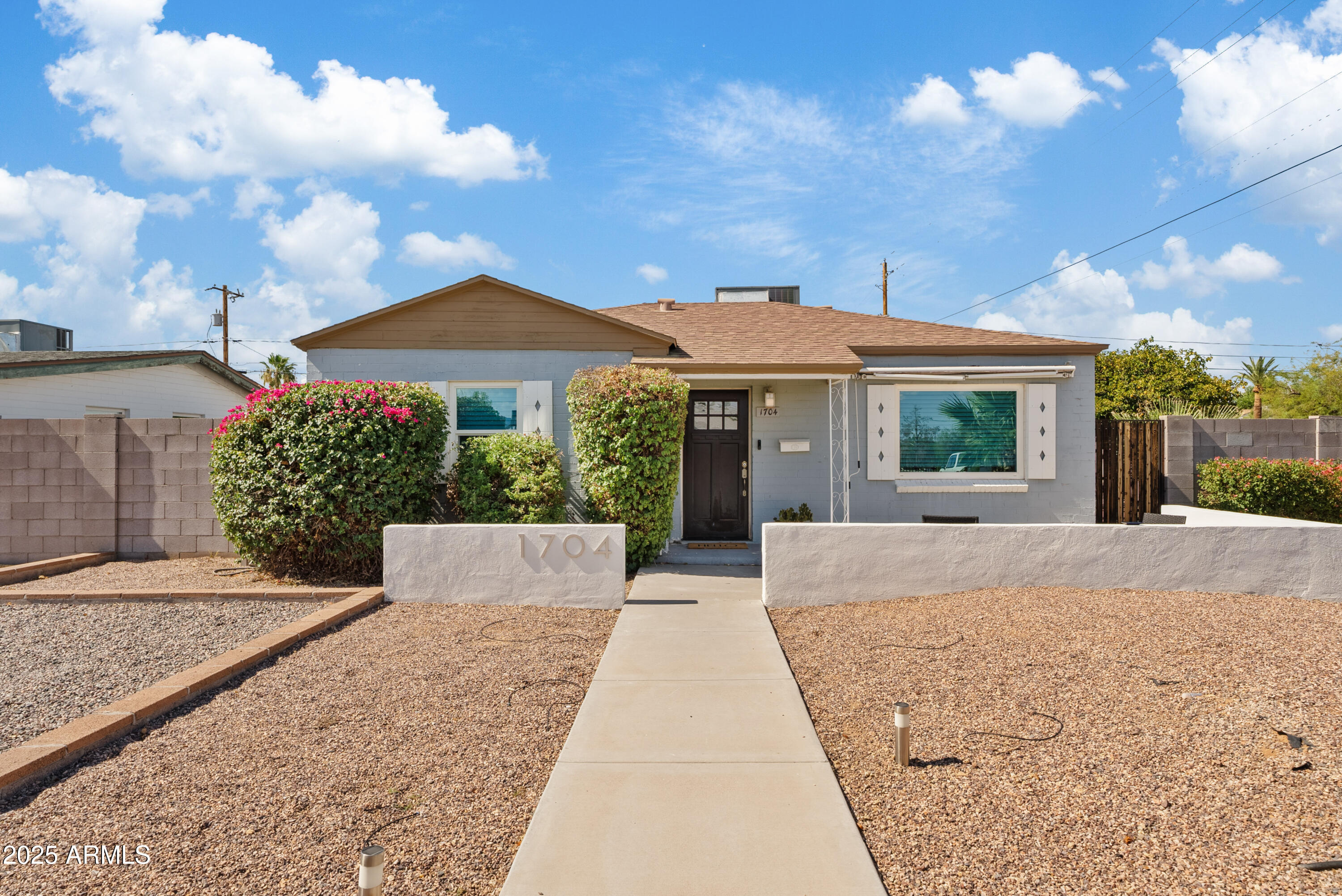 a view of house with yard and entertaining space