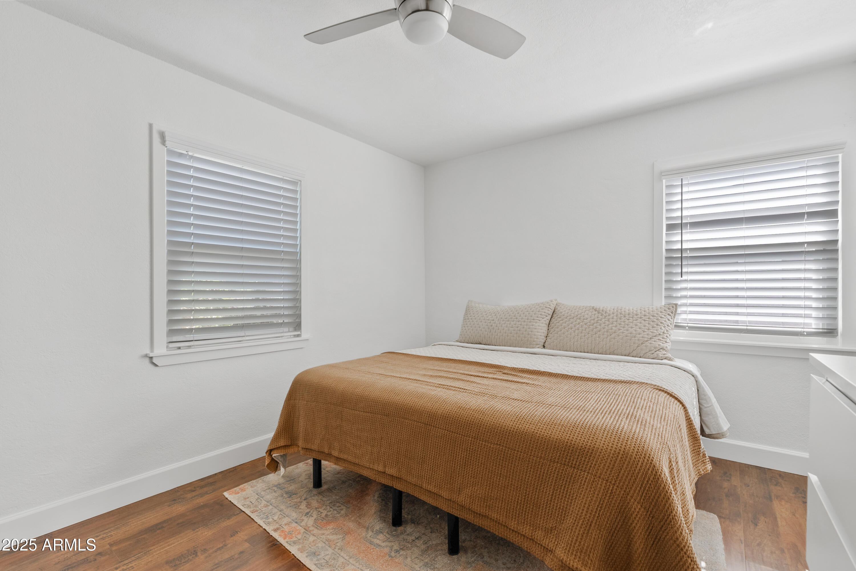 1704 West Roma Avenue Phoenix, AZ 85015 - Photo 13 of 21 a bedroom with a bed and window