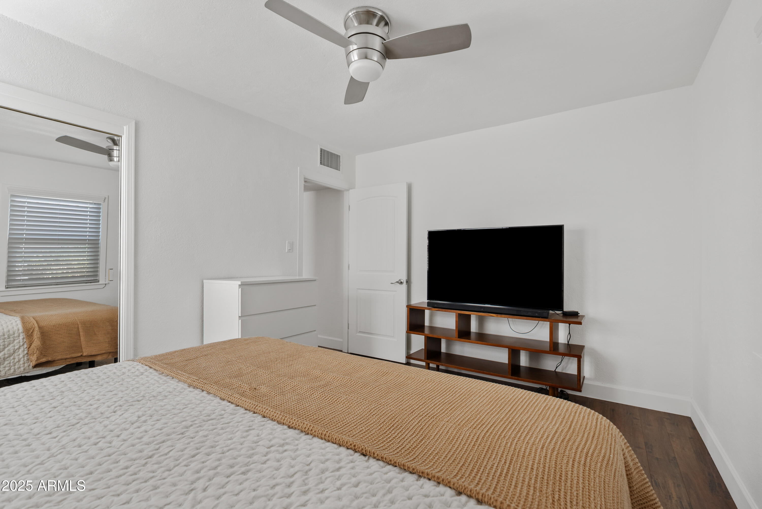 1704 West Roma Avenue Phoenix, AZ 85015 - Photo 14 of 21 a bedroom with bed table and television