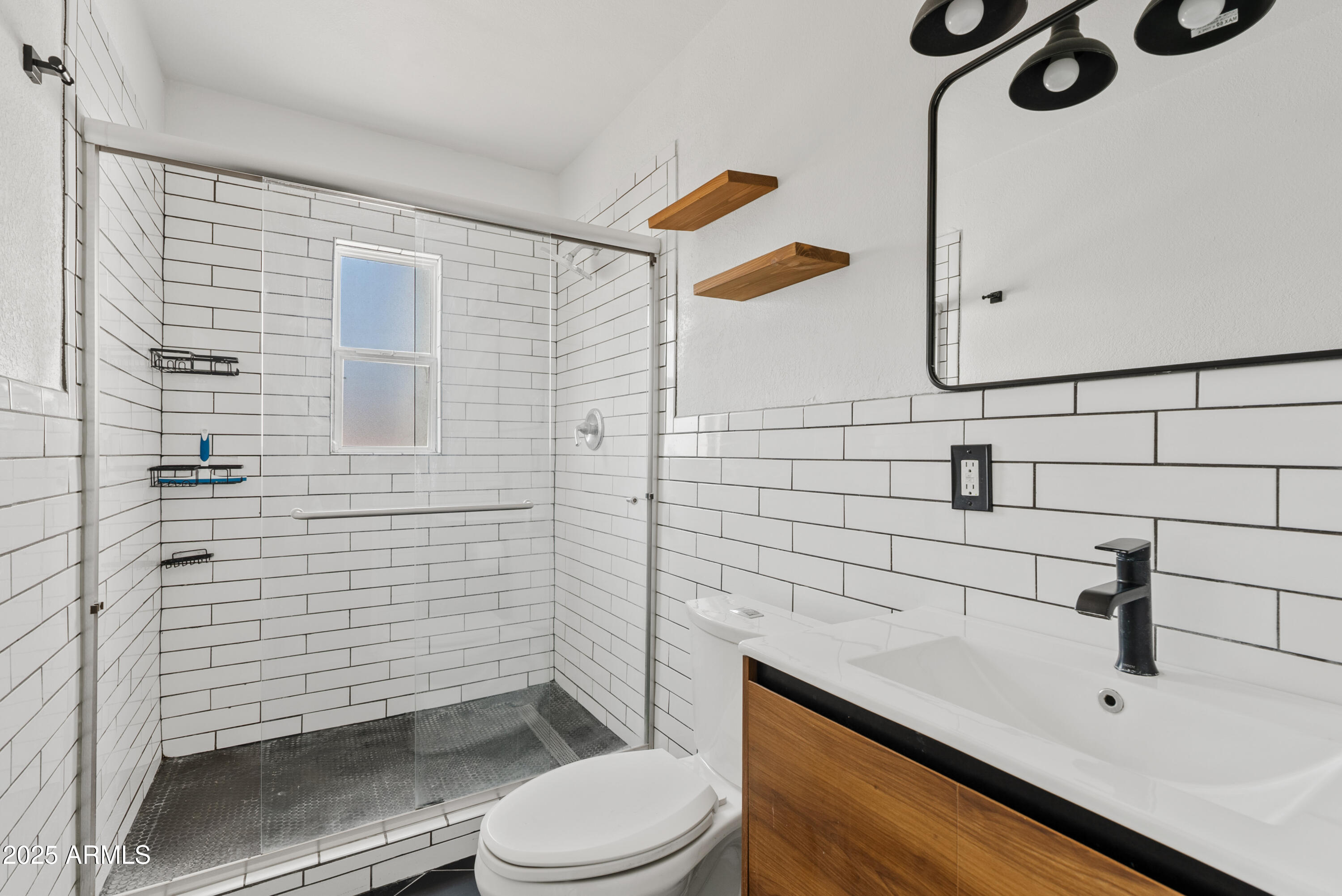1704 West Roma Avenue Phoenix, AZ 85015 - Photo 15 of 21 a bathroom with a sink a toilet and shower