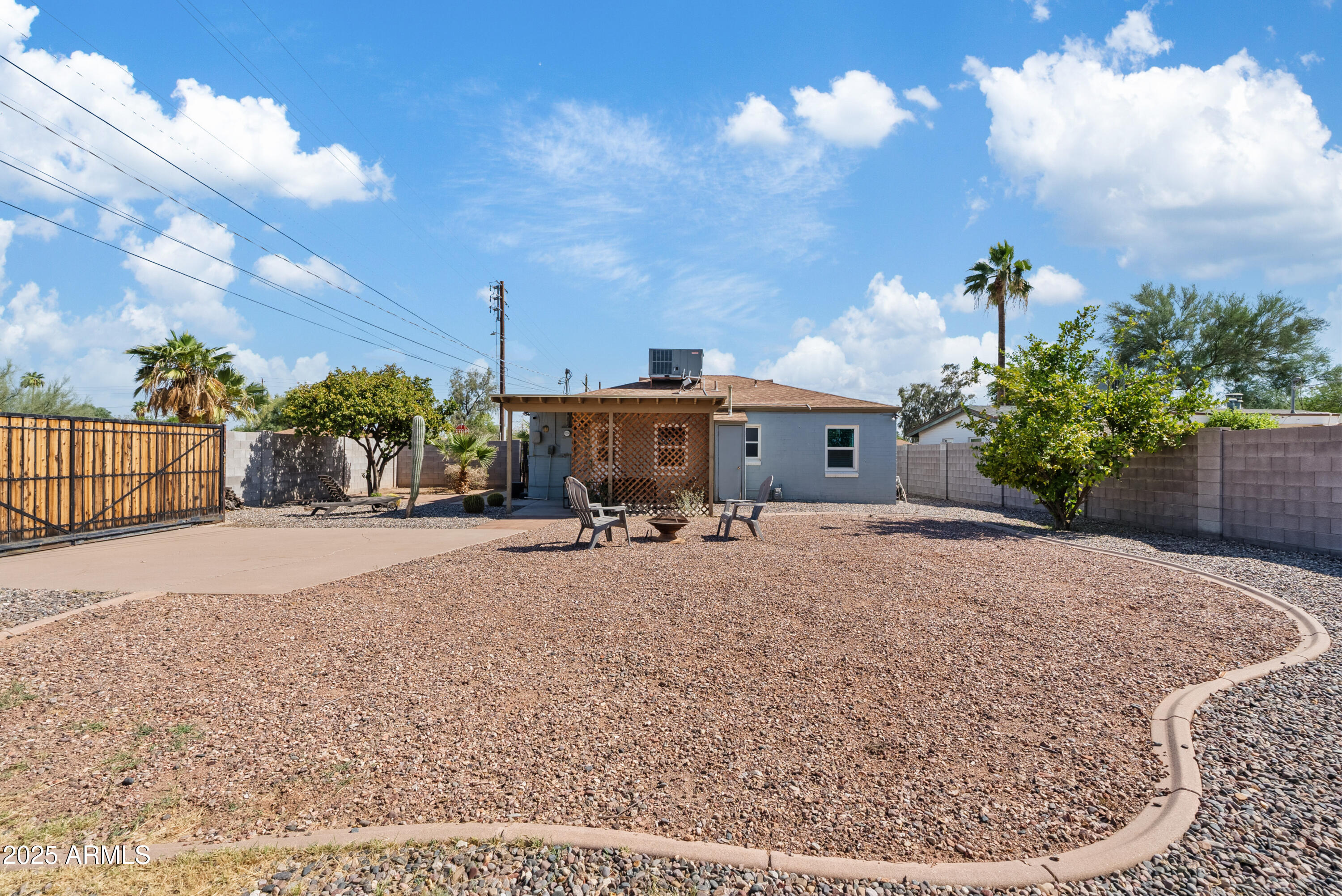 1704 West Roma Avenue Phoenix, AZ 85015 - Photo 19 of 21 a view of a house with backyard and sitting area
