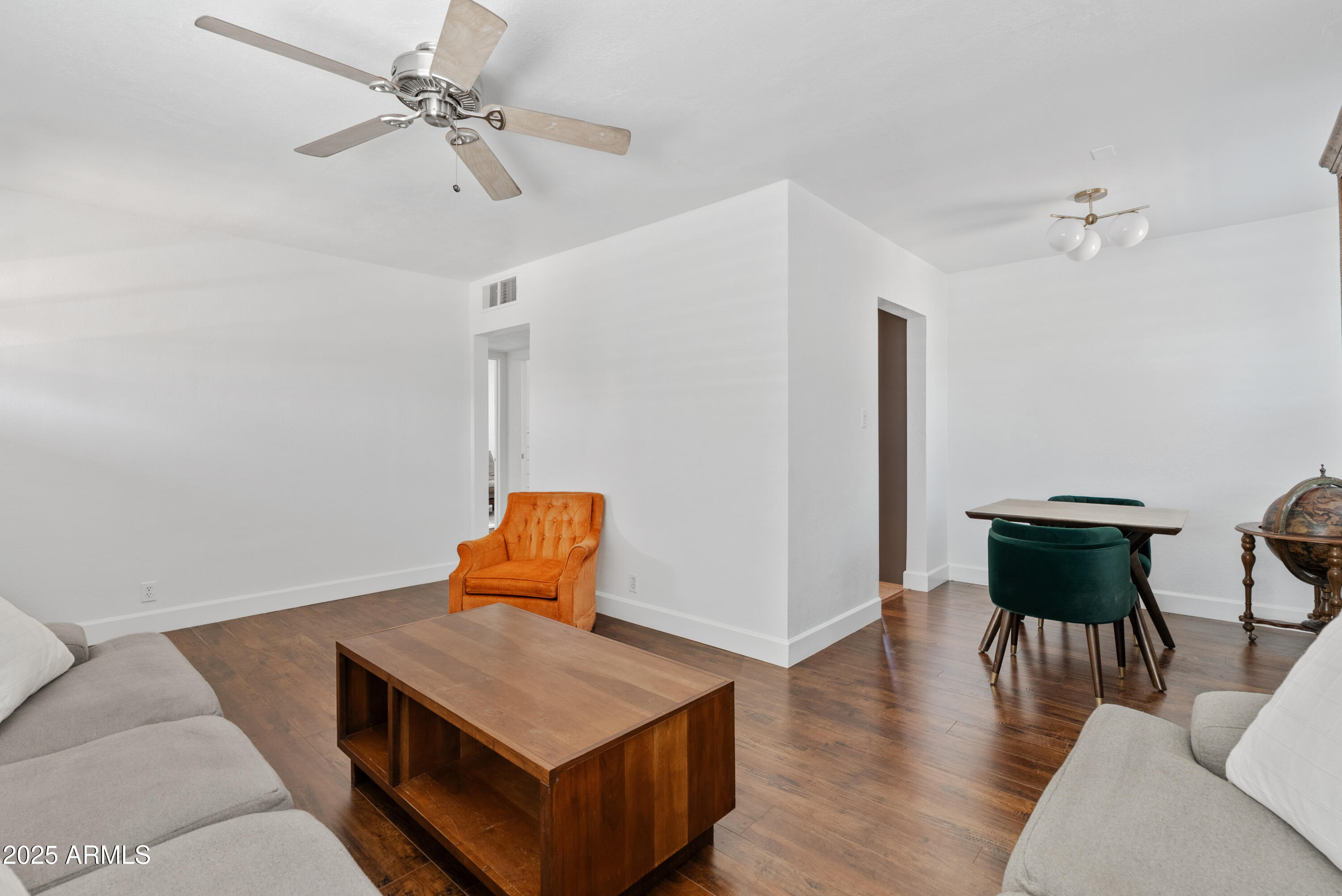 1704 West Roma Avenue Phoenix, AZ 85015 - Photo 6 of 21 a room with furniture and wooden floor
