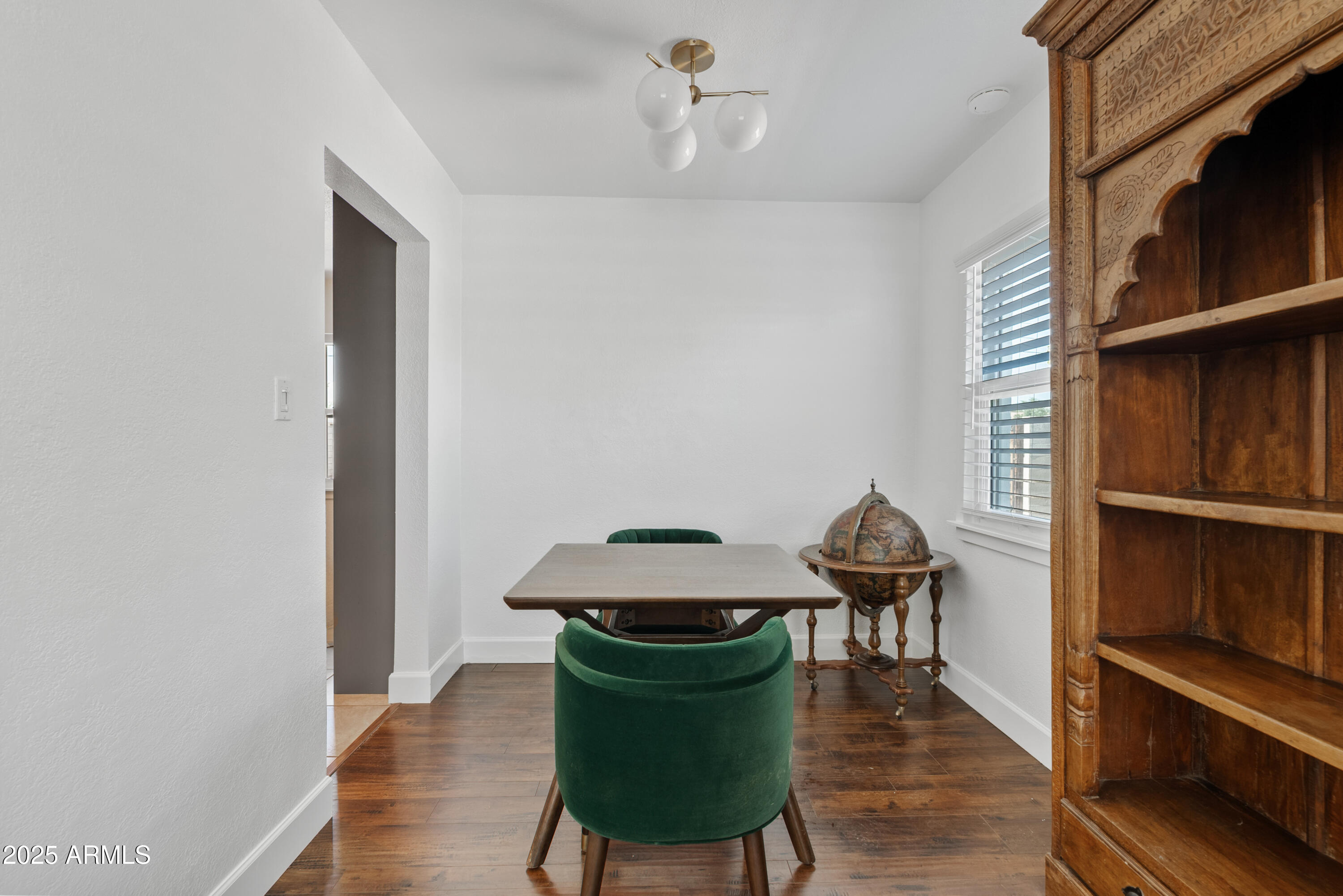 1704 West Roma Avenue Phoenix, AZ 85015 - Photo 7 of 21 a living room with furniture and a window