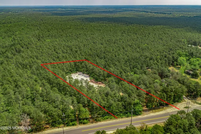 a view of a field with an ocean view