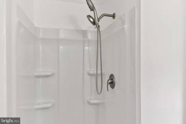 a bathroom with a sink a mirror and a toilet