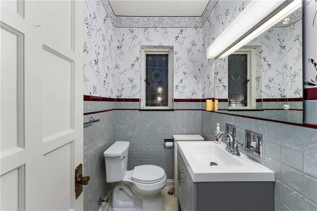 a view of a hallway with wooden floor and entryway