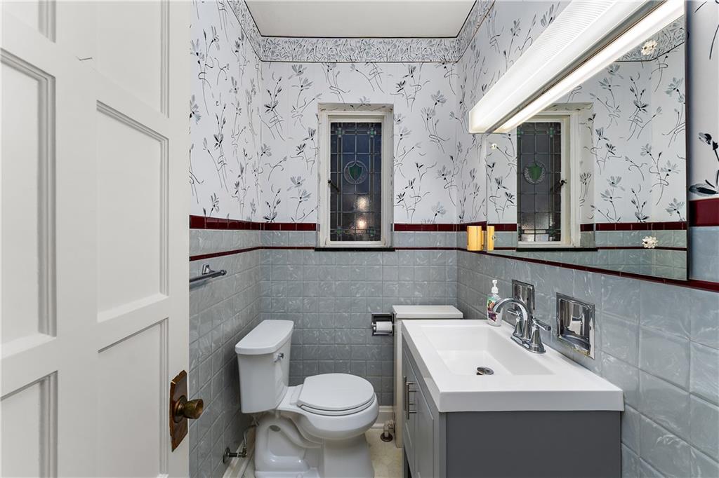 6 Churchill Road Pittsburgh, PA 15235 - Photo 18 of 42 a bathroom with a toilet sink and mirror