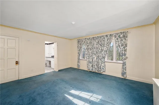 a view of a room with cabinet and a ceiling fan