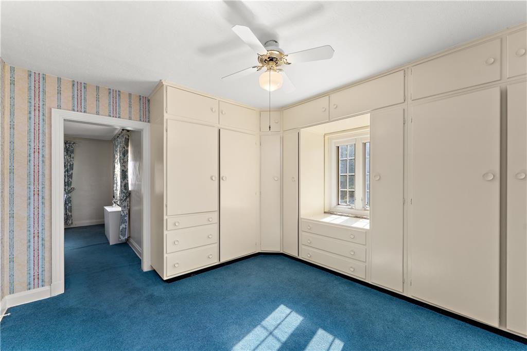 6 Churchill Road Pittsburgh, PA 15235 - Photo 23 of 42 a view of a room with cabinet and a ceiling fan