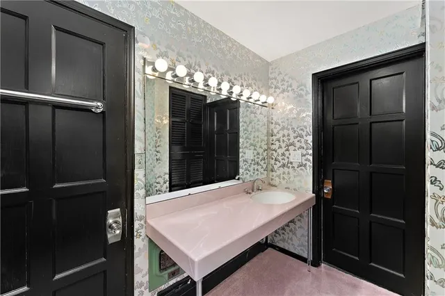 a view of a kitchen with a sink and a window