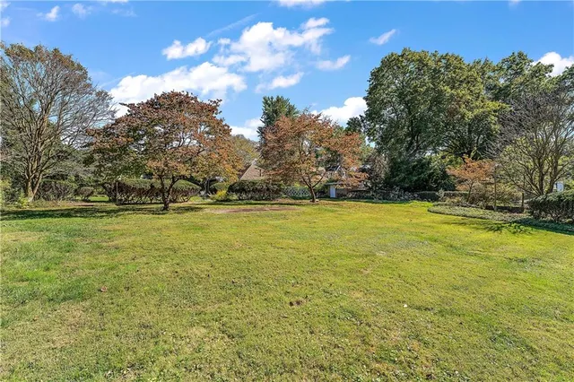 an aerial view of a house with a yard and garden