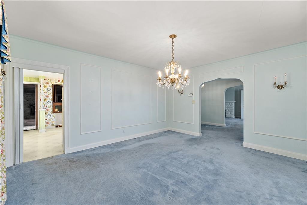 6 Churchill Road Pittsburgh, PA 15235 - Photo 5 of 42 a view of a room with a chandelier fan and windows