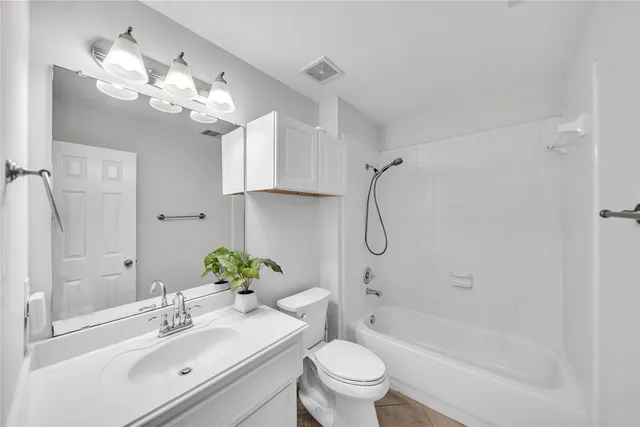 a view of a hallway with wooden floor and closet