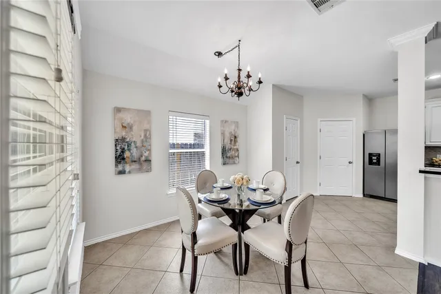 a living room with furniture fireplace and window