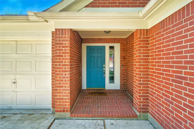 a view of a door and wooden floor