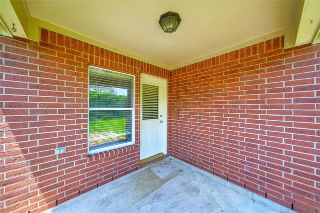 a front view of a house with a yard and green space