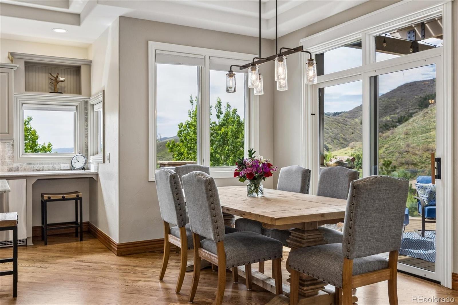 16422 Rocky Point Lane Morrison, CO 80465 - Photo 6 of 50 a view of a dining room with furniture window and wooden floor