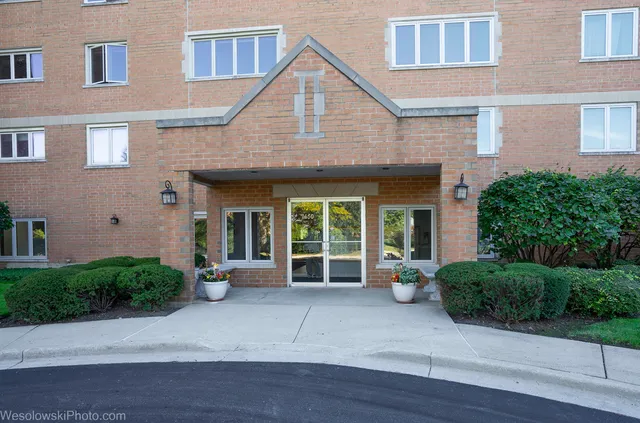 a view of a house with table and chairs in porch
