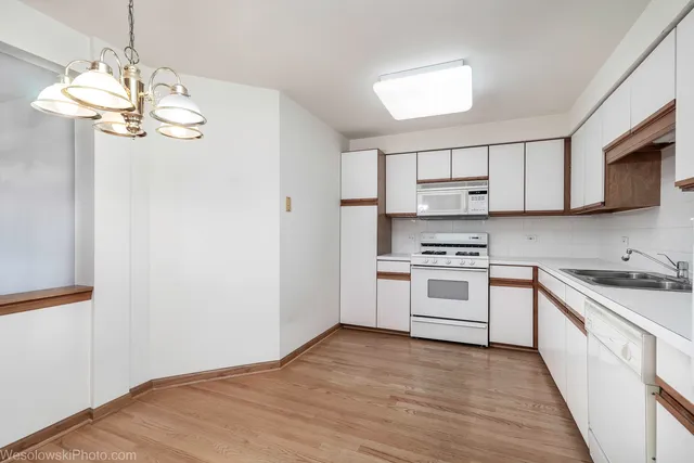 a kitchen with stainless steel appliances granite countertop a stove and a sink