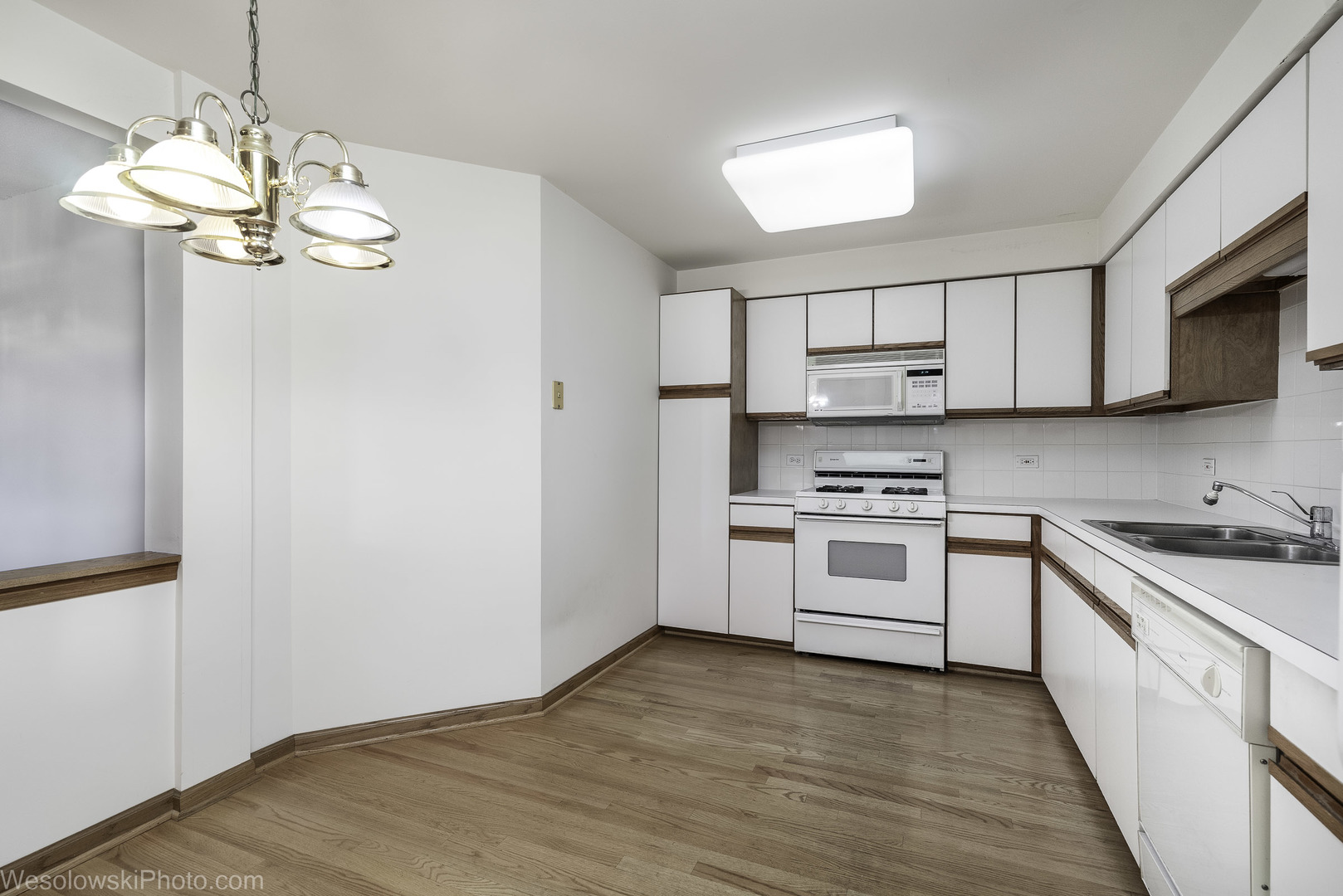 7450 Waukegan Road, Unit 206 Niles, IL 60714 - Photo 17 of 26 a kitchen with stainless steel appliances granite countertop a stove and a sink