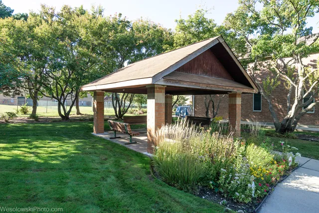 a backyard of a house with yard barbeque oven and green space