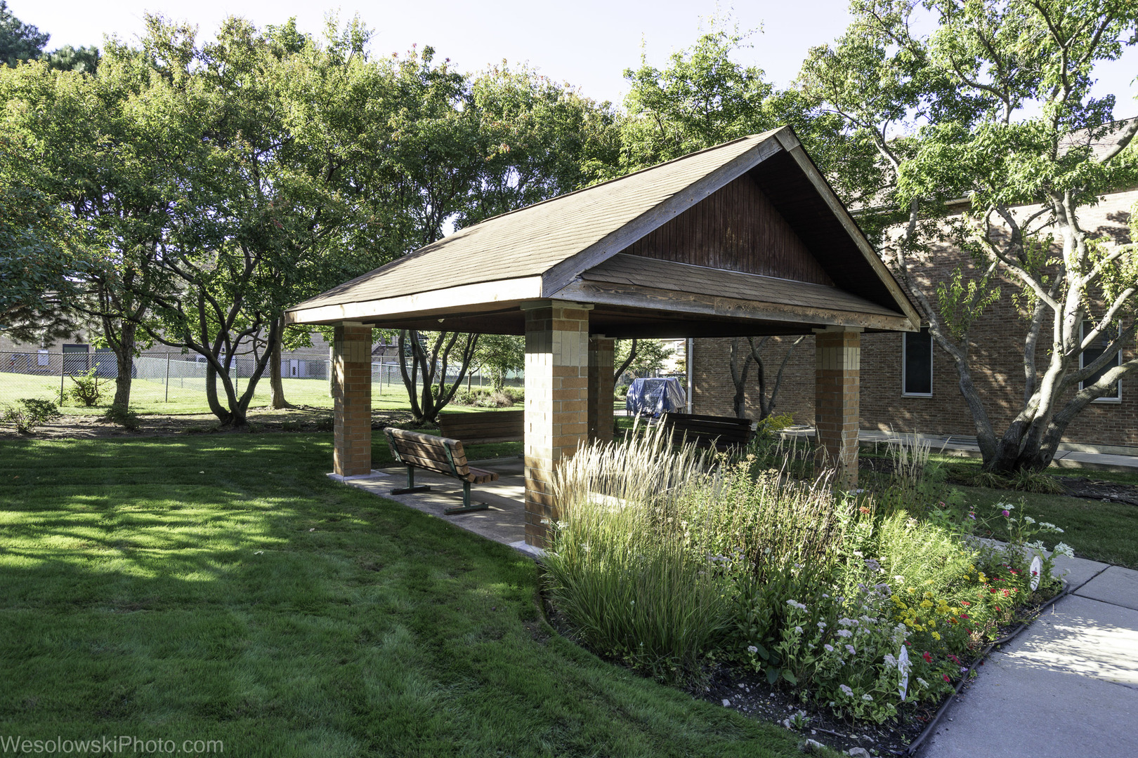 7450 Waukegan Road, Unit 206 Niles, IL 60714 - Photo 26 of 26 a backyard of a house with yard barbeque oven and green space